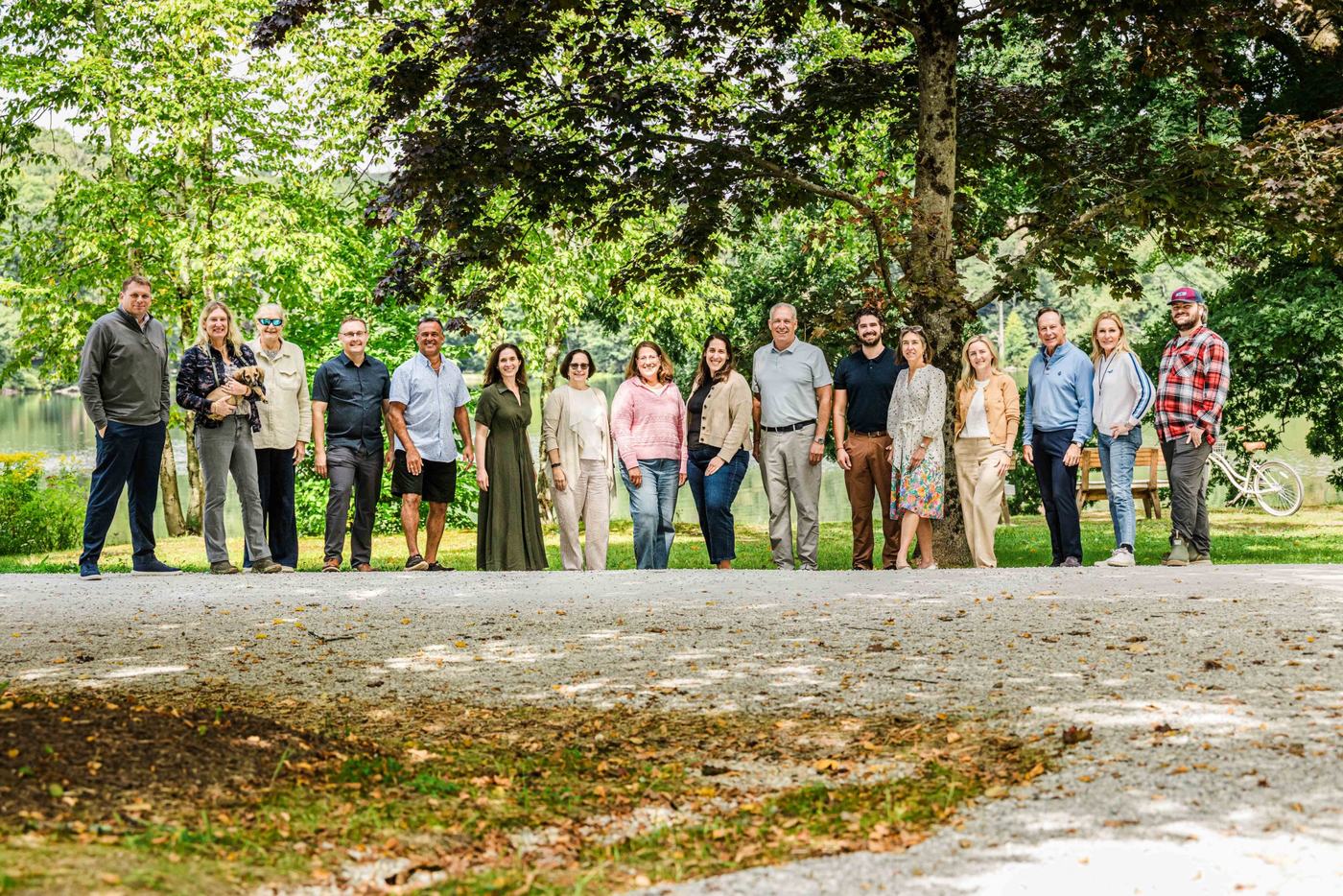 Stride families gathered on a lakeshore path at the 2026 Berkshires retreat